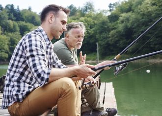 Men talking and fishing together